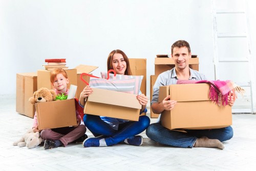 Careful wrapping of fragile household items for relocation