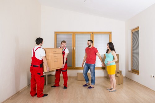 Moving team handling a flat move near Putney riverside homes