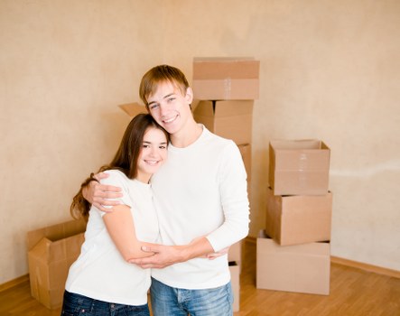 Packed boxes and furniture prepared for a house move in Putney