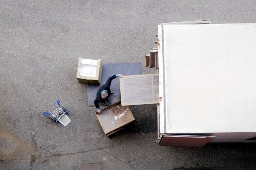 Removal team loading household items for a UK moving service